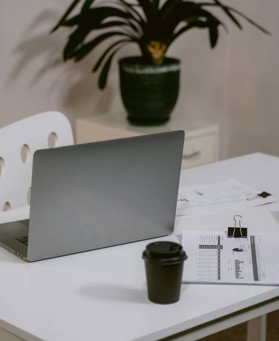 silver laptop on the table